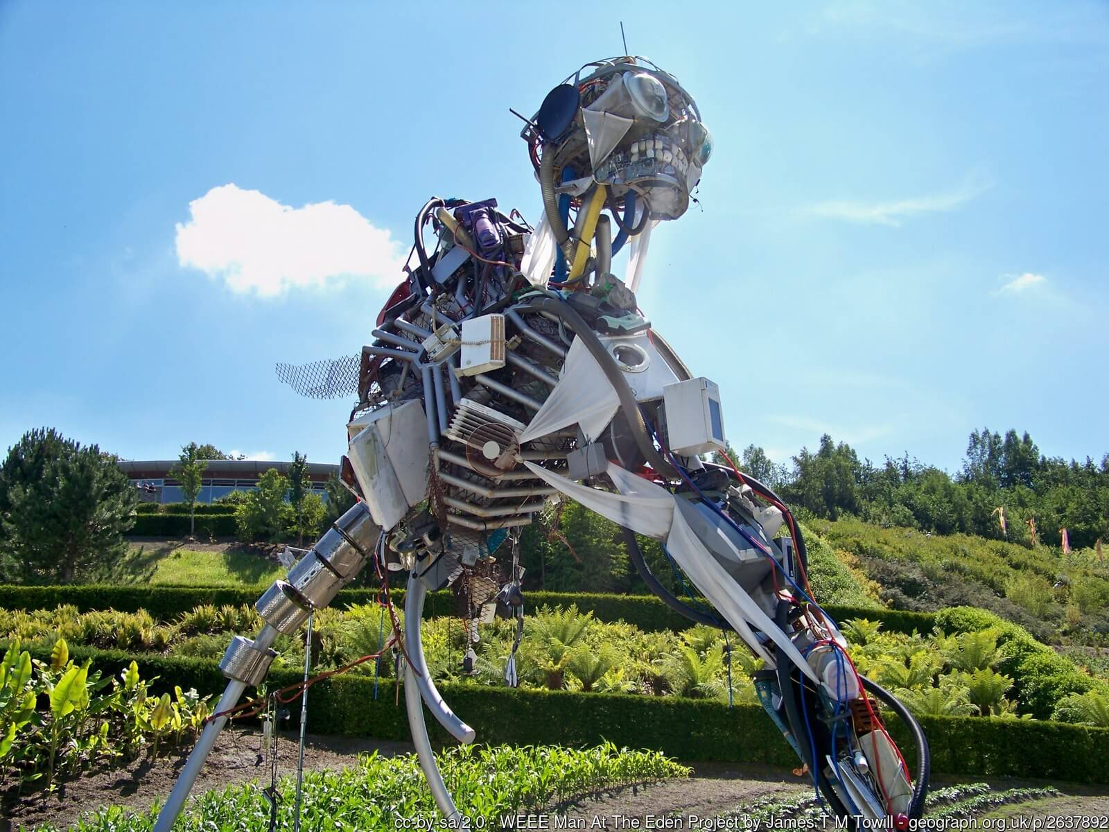 Image of "WEEE Man" statue, which is made from 3.3 metric tons of electrical waste, or the average amount of e-waste that one UK individual creates in a lifetime. (Photograph by James T.M. Towill and <a href="https://www.geograph.org.uk/photo/2637892">published</a> under a <a href="https://spdx.org/licenses/CC-BY-SA-2.0.html">CC-BY-SA-2.0</a> license.)